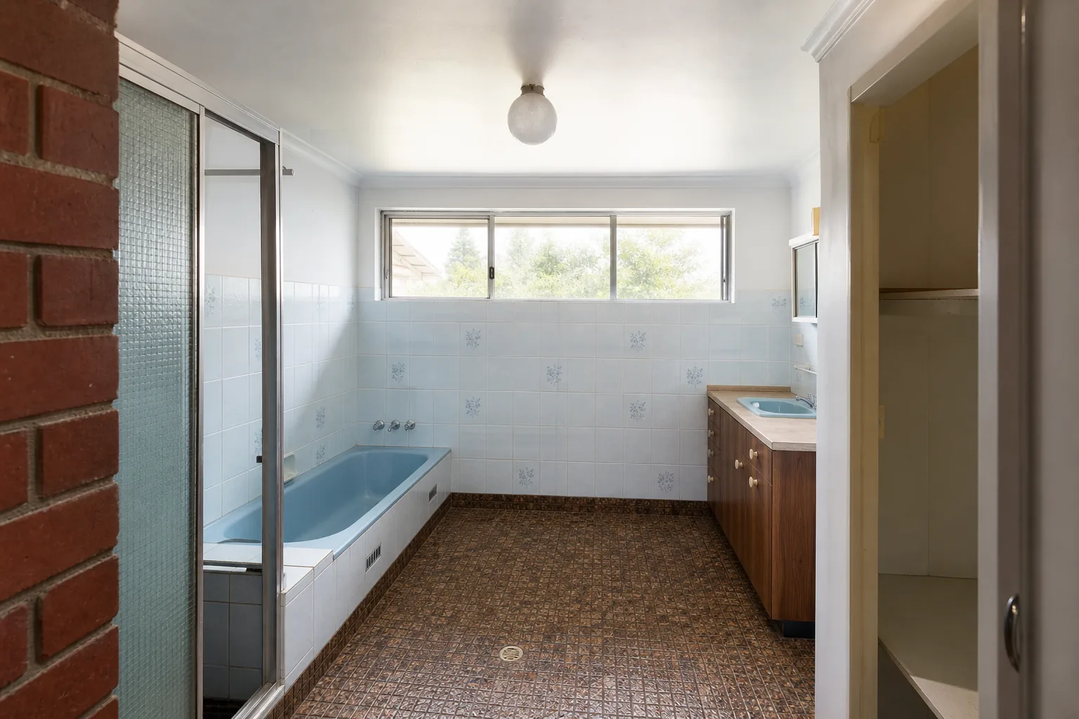 Representative 1960s brick home bathroom concept before renovation